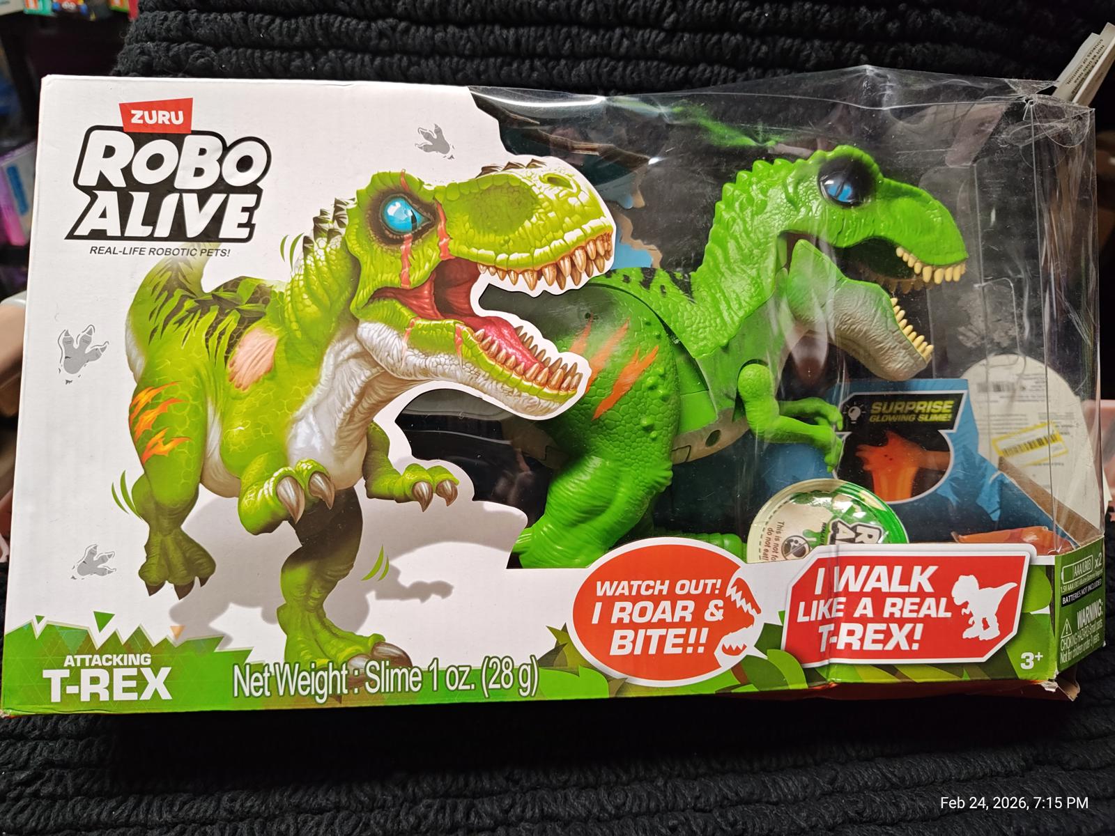 Robo Alive T-Rex toy features realistic movements and sounds, including roaring and biting actions.