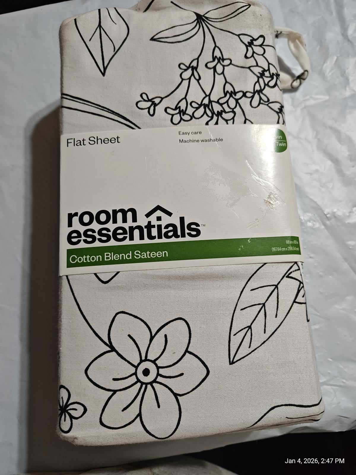 Room Essentials cotton blend flat sheet featuring floral design and black outlines.
