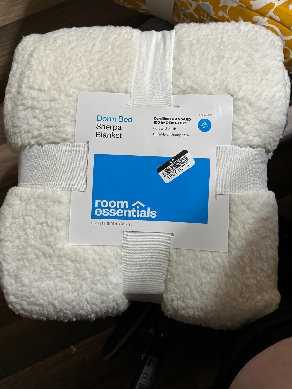 Room Essentials dorm bed sherpa blanket in white, soft and cozy for comfortable sleeping.