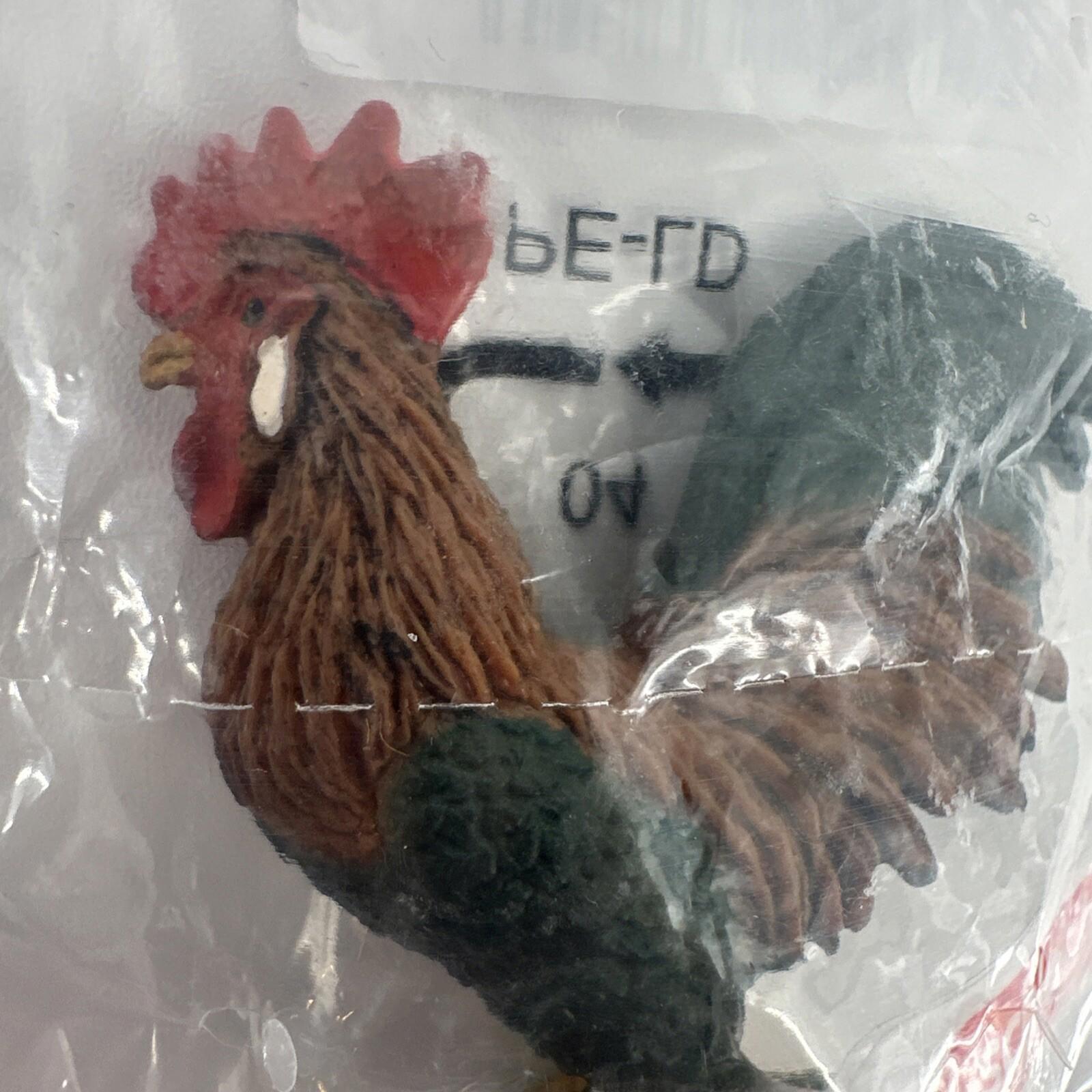 Rooster figurine with detailed feathers and vibrant colors, perfect for home decor.