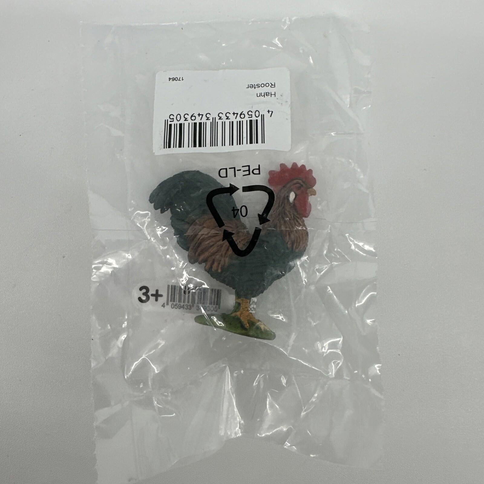 Rooster figurine in a clear package, colorful details and realistic design.