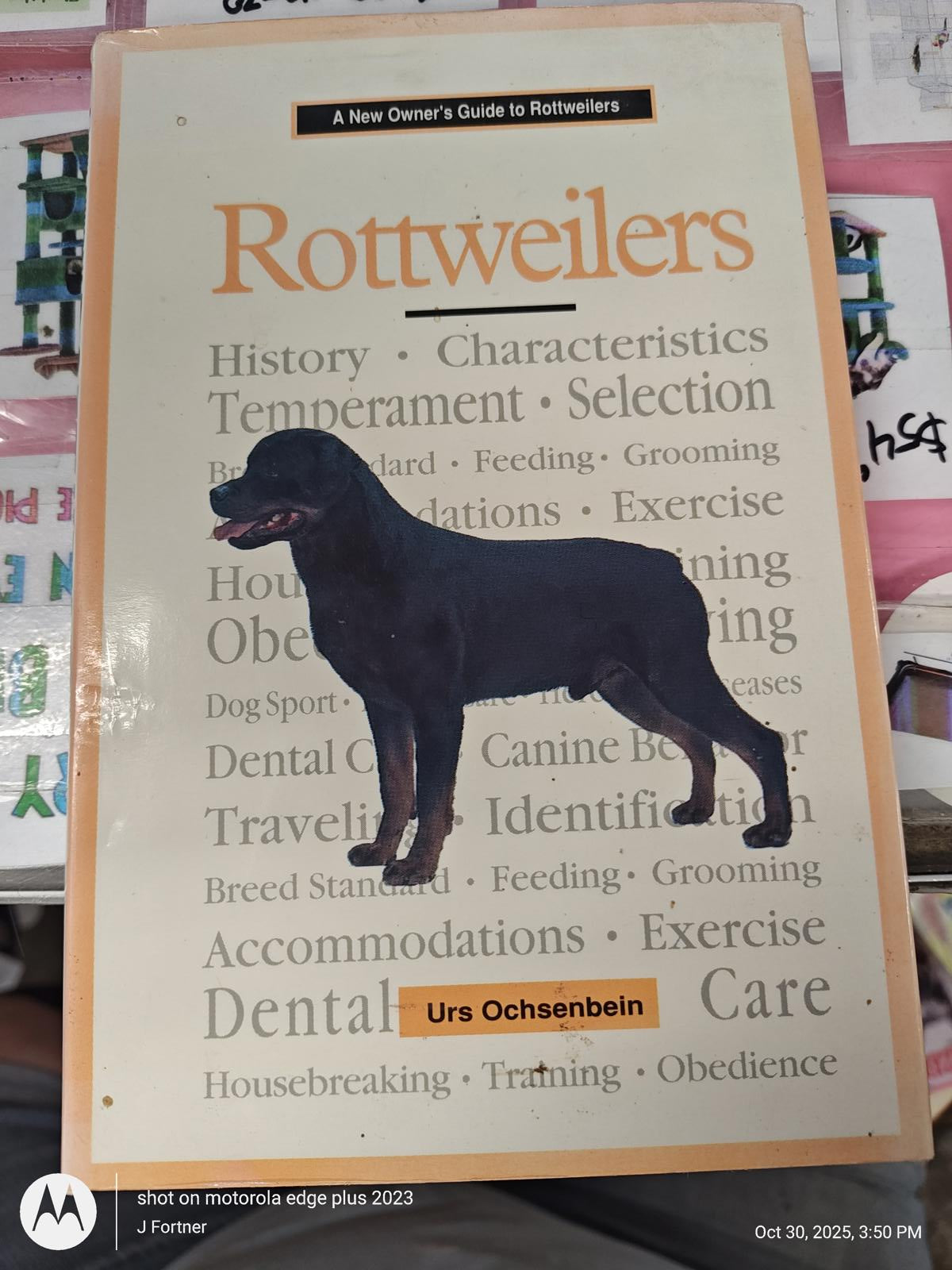 Rottweilers book cover featuring a black Rottweiler illustration and informative text.