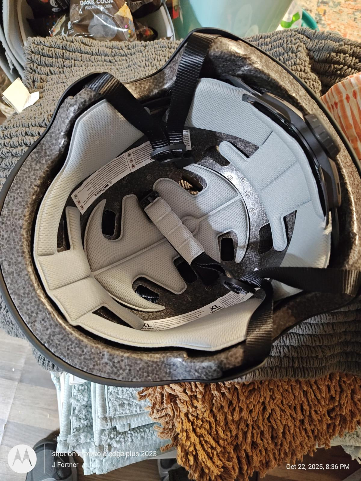 Safety Helmet interior with padding and straps for comfort and protection.