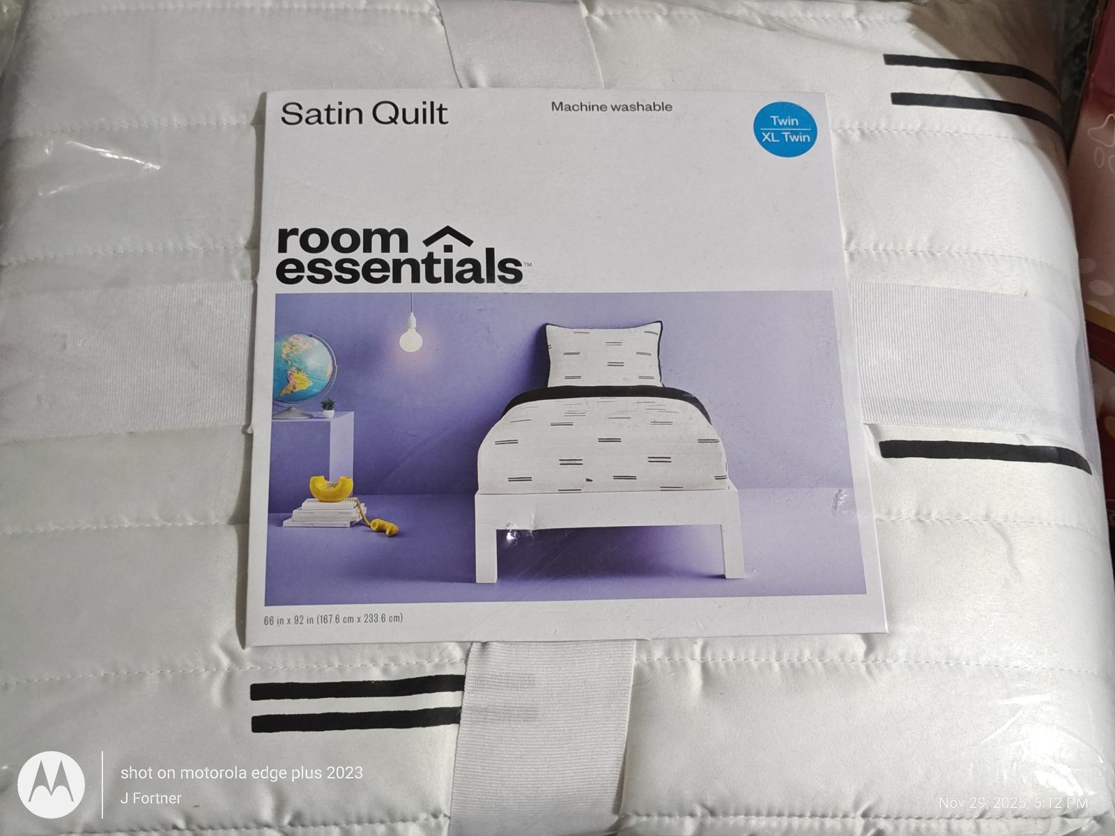 Satin Quilt by Room Essentials featuring a white design with black stripes and a modern bed setup.