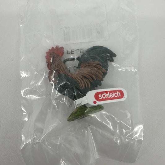 Schleich rooster figurine in packaging, featuring detailed feathers and vibrant colors.