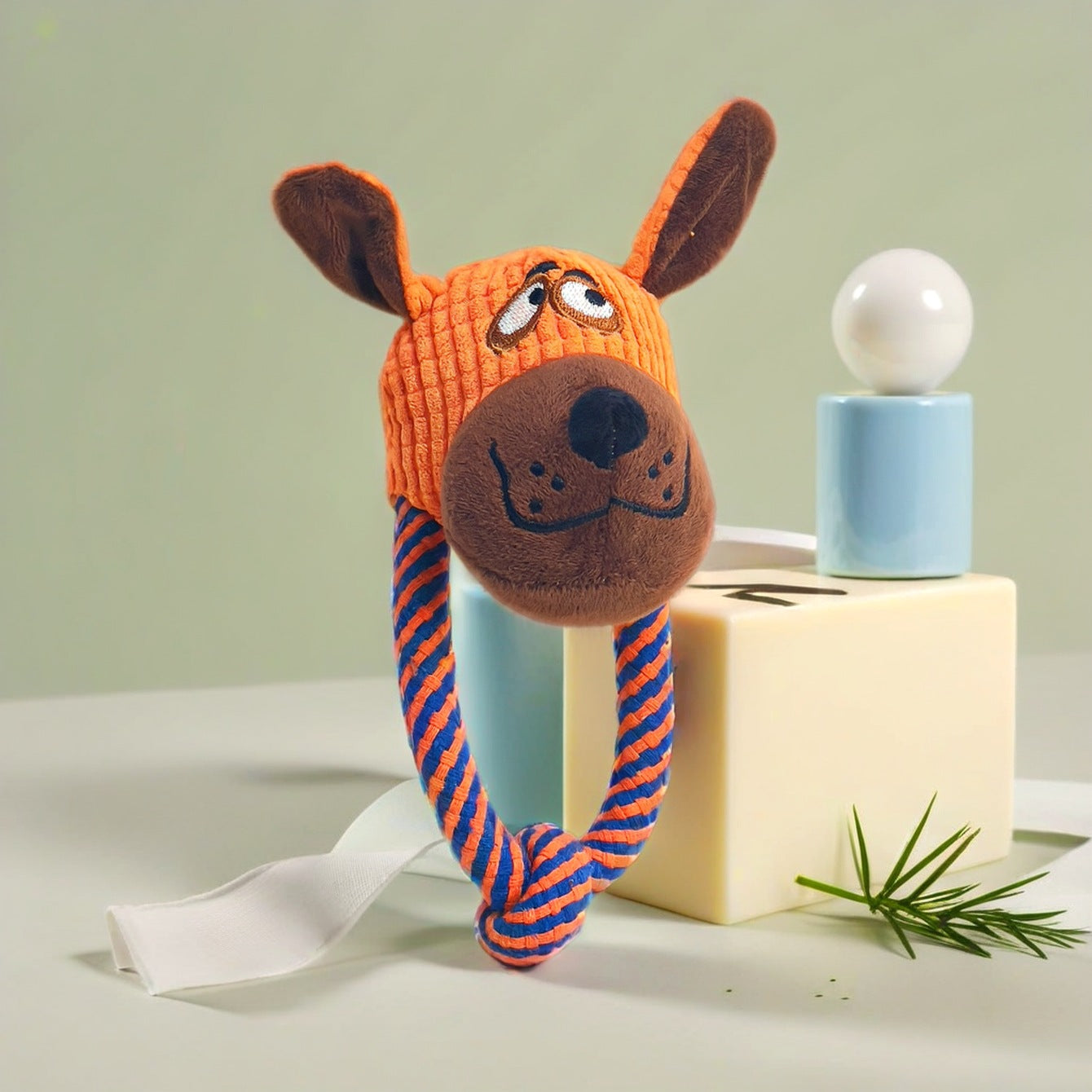 Scooby-Doo dog toy featuring an orange knitted head and rope body for playful fun.