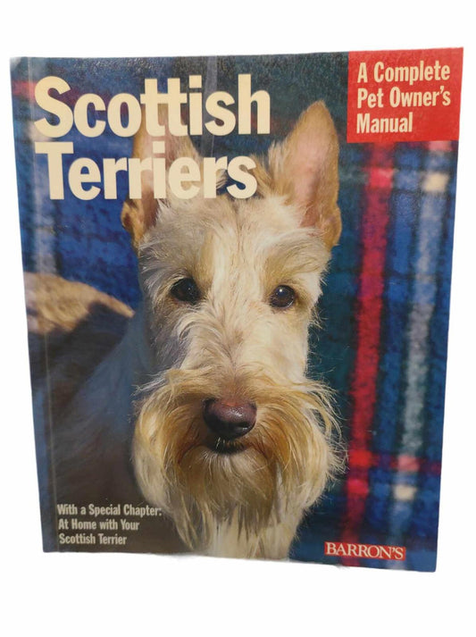 Scottish Terriers manual featuring a close-up of a Scottish Terrier on a colorful background.