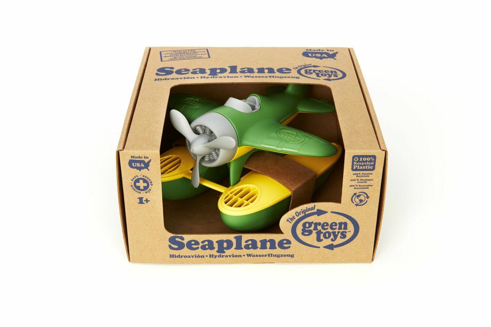 Seaplane toy by Green Toys in eco-friendly packaging, featuring a green body and yellow accents.