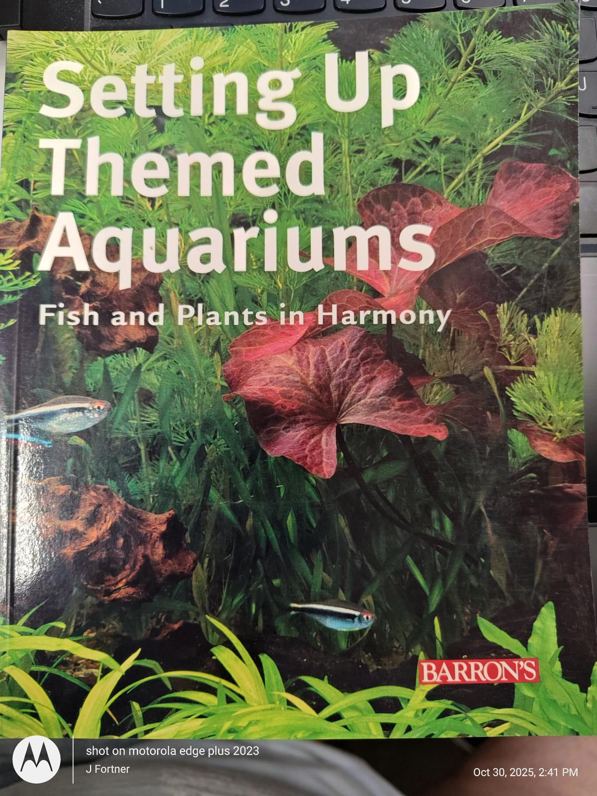 Setting Up Themed Aquariums book cover featuring vibrant aquatic plants and fish.