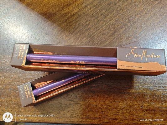 Shea Moisture lip liner in purple packaging, showcasing the product's sleek design and vibrant color.