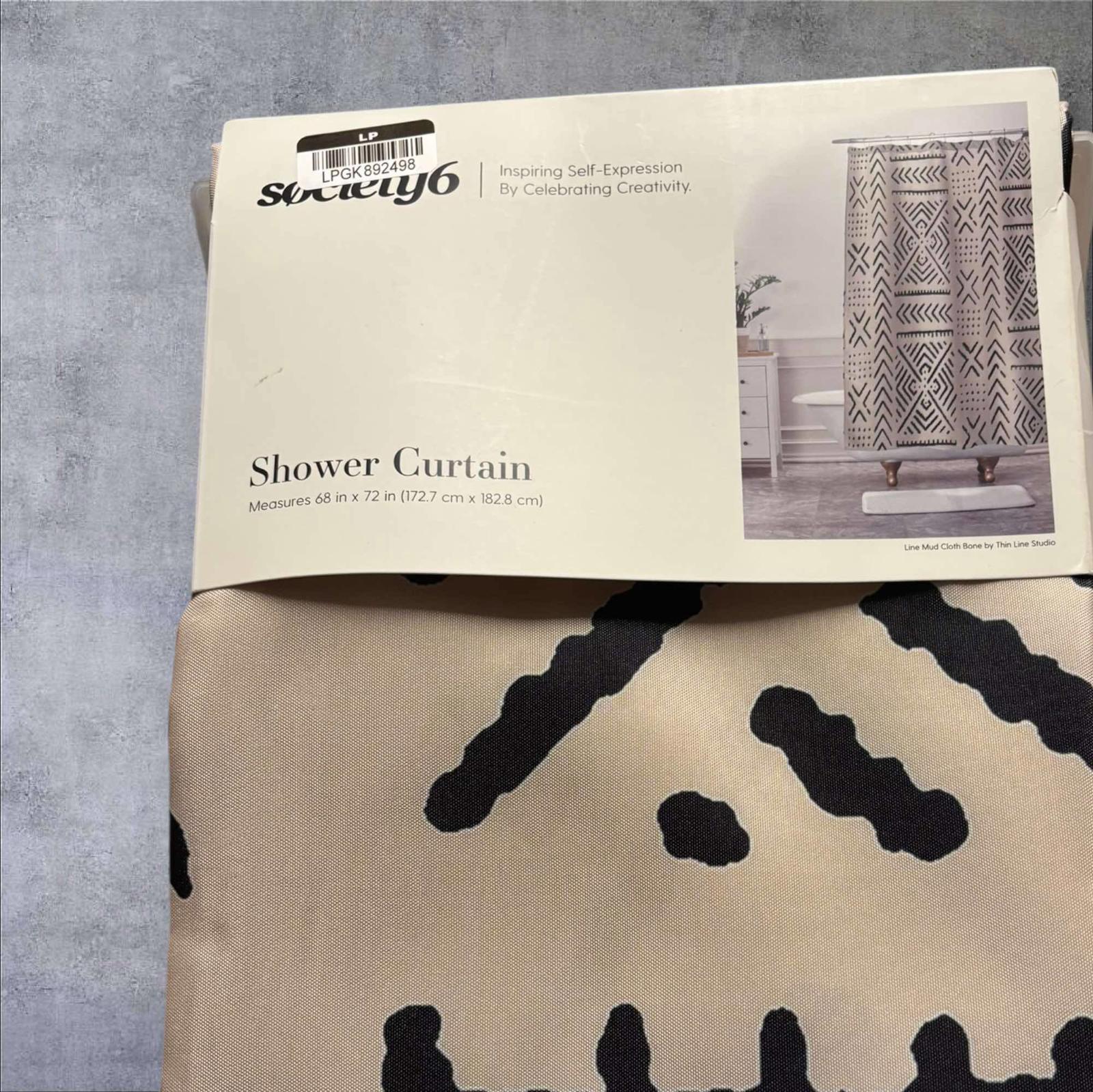 Shower Curtain featuring a modern design with black patterns on a beige background.