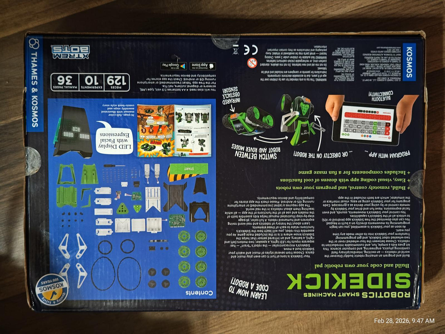 Sidekick robot building kit with various components and instructions for assembly.