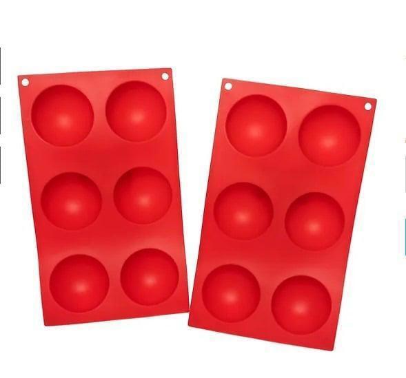 Silicone cake mold set featuring two red trays with six round cavities each.