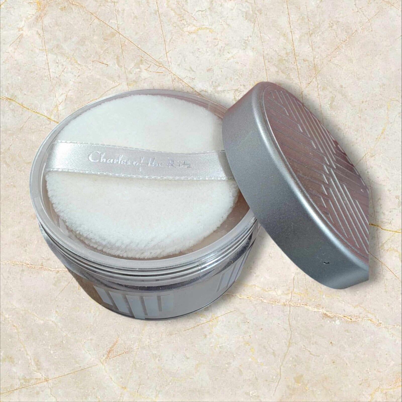 Silk Powder Puff for flawless makeup application in a silver container.