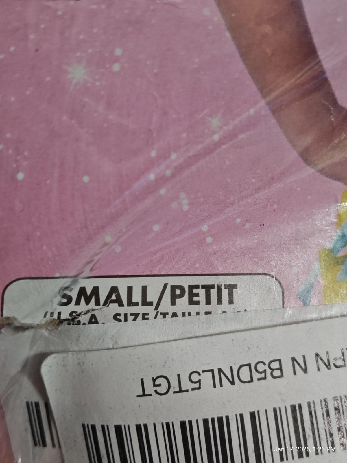 Small size label on a colorful product packaging with a pink background.
