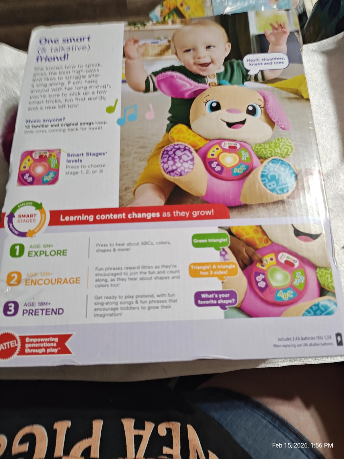 Smart Stages Puppy toy with colorful buttons and a smiling baby playing. Engaging learning features for toddlers.