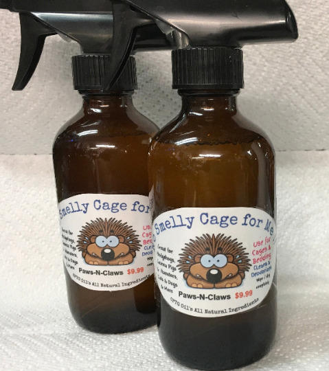 Smelly Cage for Me spray bottles with cartoon hedgehog label, ideal for pet odor control.