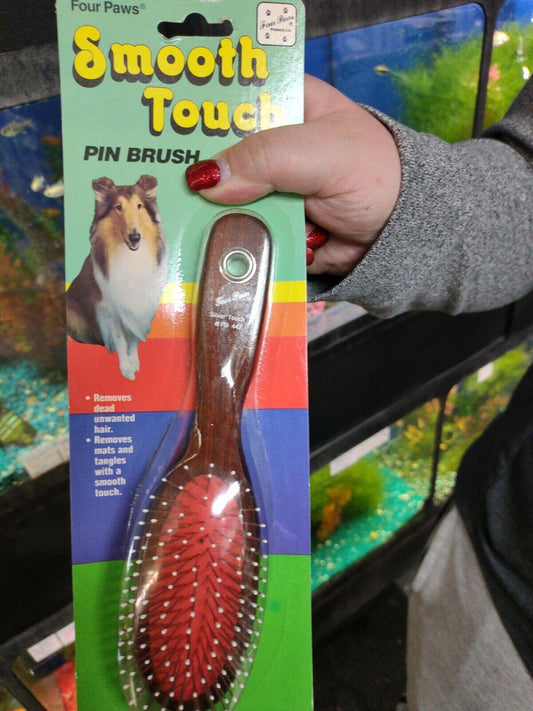 Smooth Touch Pin Brush with red bristles and wooden handle for grooming pets.