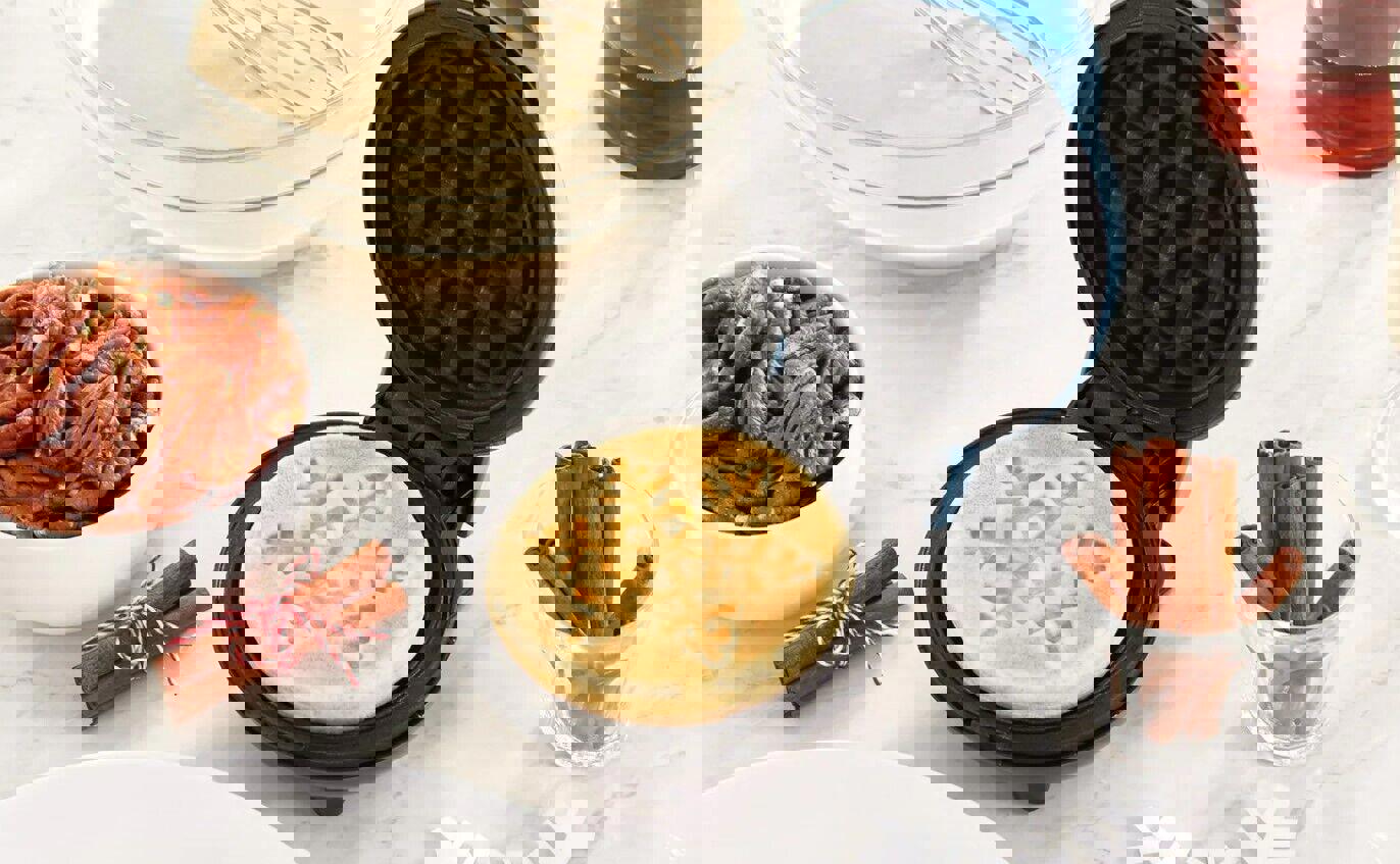 Snowflake waffle maker creates festive waffles with intricate designs.