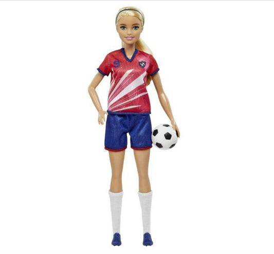 Barbie Soccer Player Doll wearing a red and blue uniform, holding a soccer ball.
