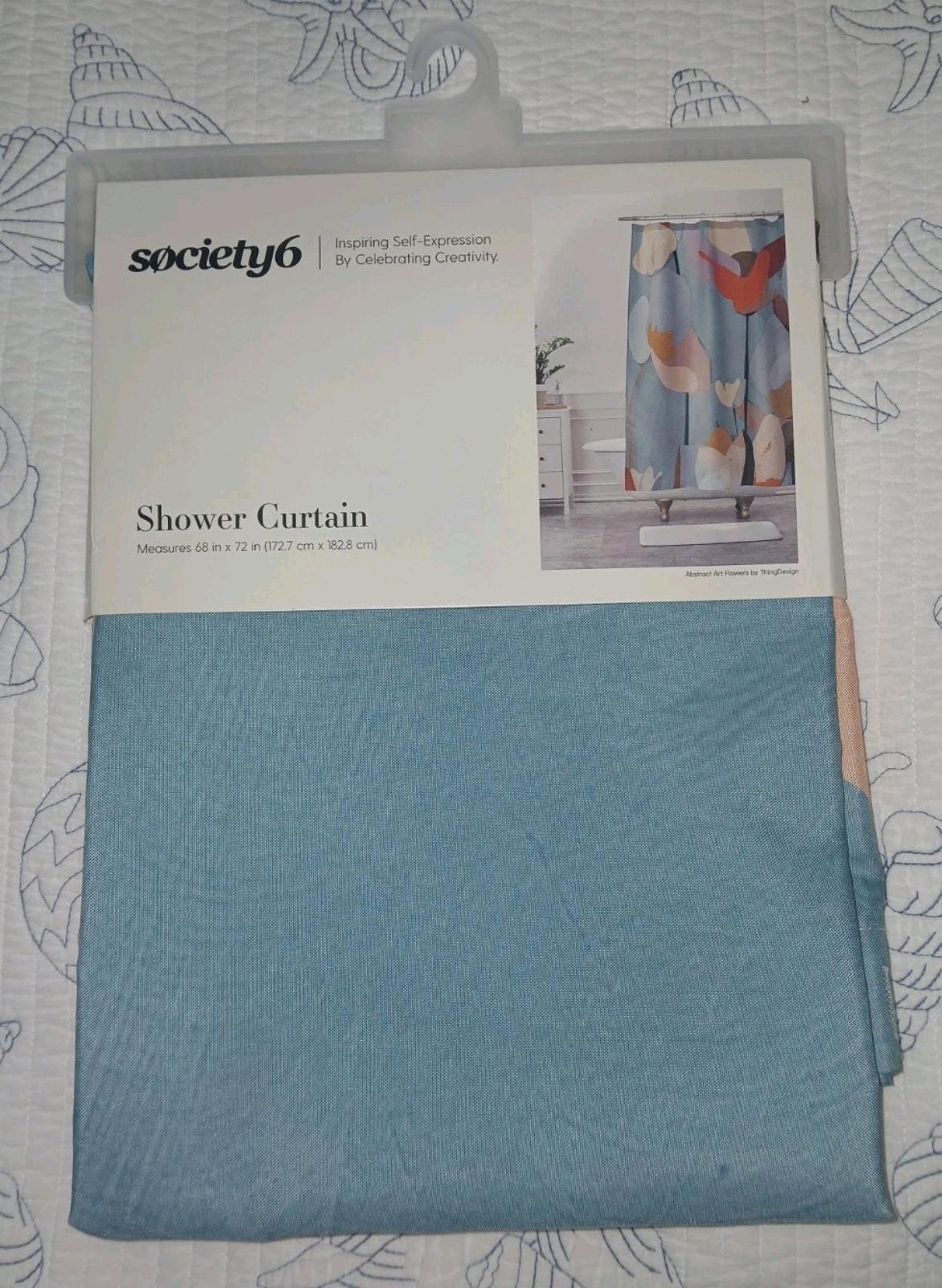 Society6 shower curtain featuring a blue and peach design, perfect for modern bathrooms.
