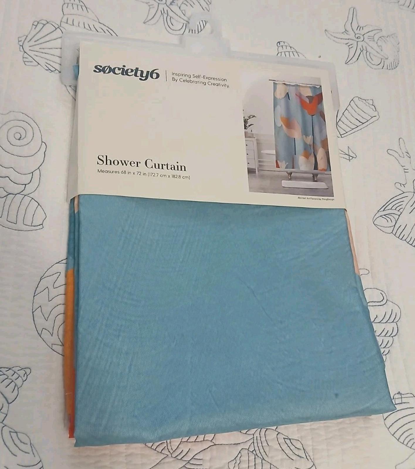 Society6 Shower Curtain featuring a colorful design with blue and coral accents.