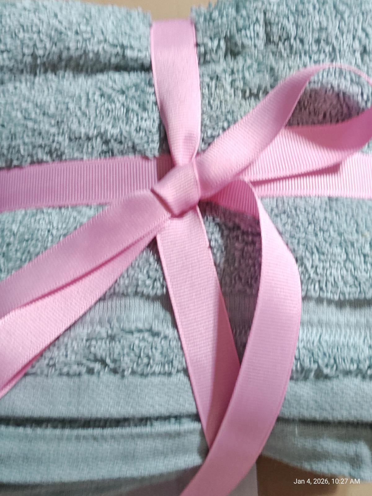 Soft Aqua Bath Towels set tied with a pink ribbon for a stylish presentation.