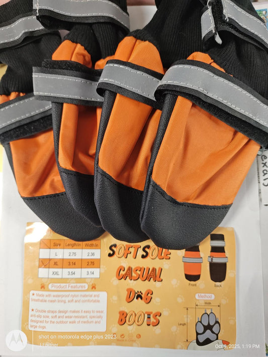 Softsole casual dog boots in orange and black with reflective straps for added safety.