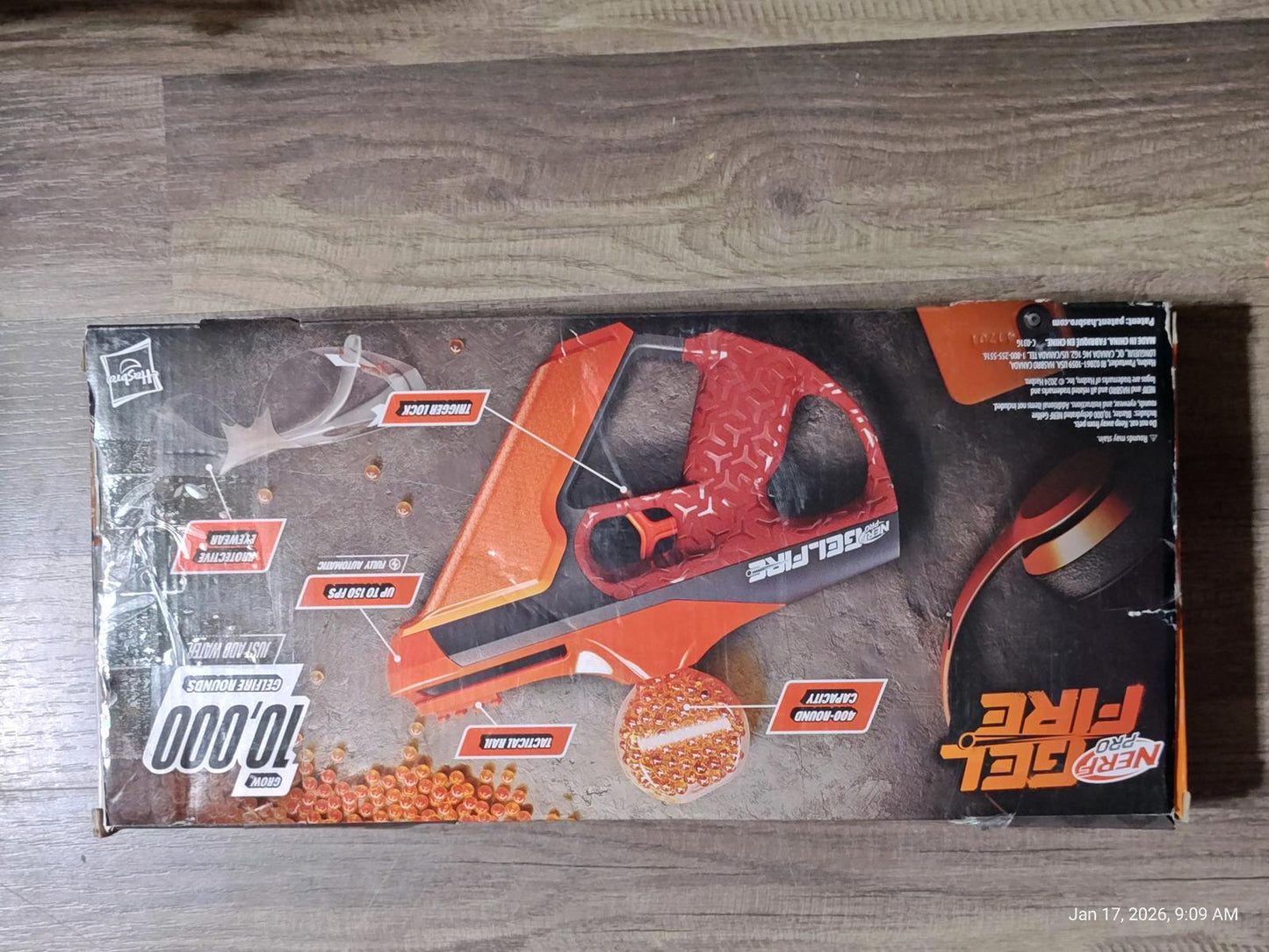 SplatRBall Gel Blaster in orange color with packaging details visible.