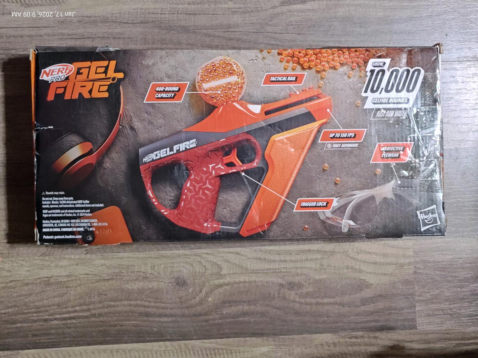 SplatRBall Gel Blaster in orange color with packaging details visible.