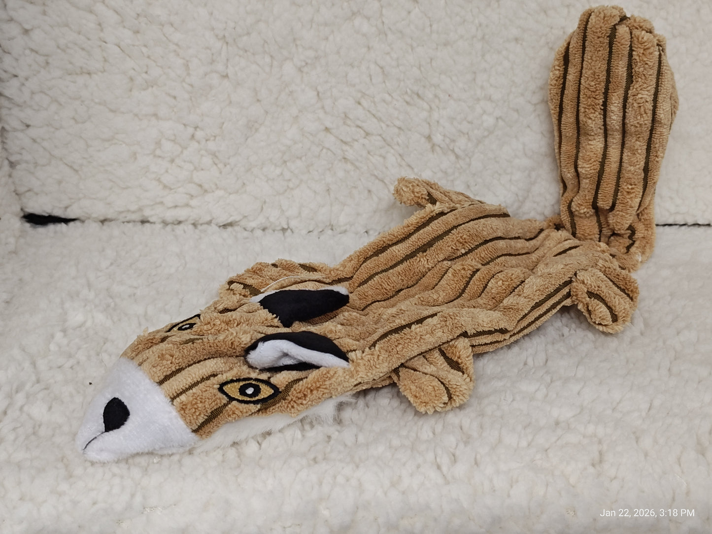 Squirrel Plush Toy featuring a soft, brown fur texture and cute facial details.