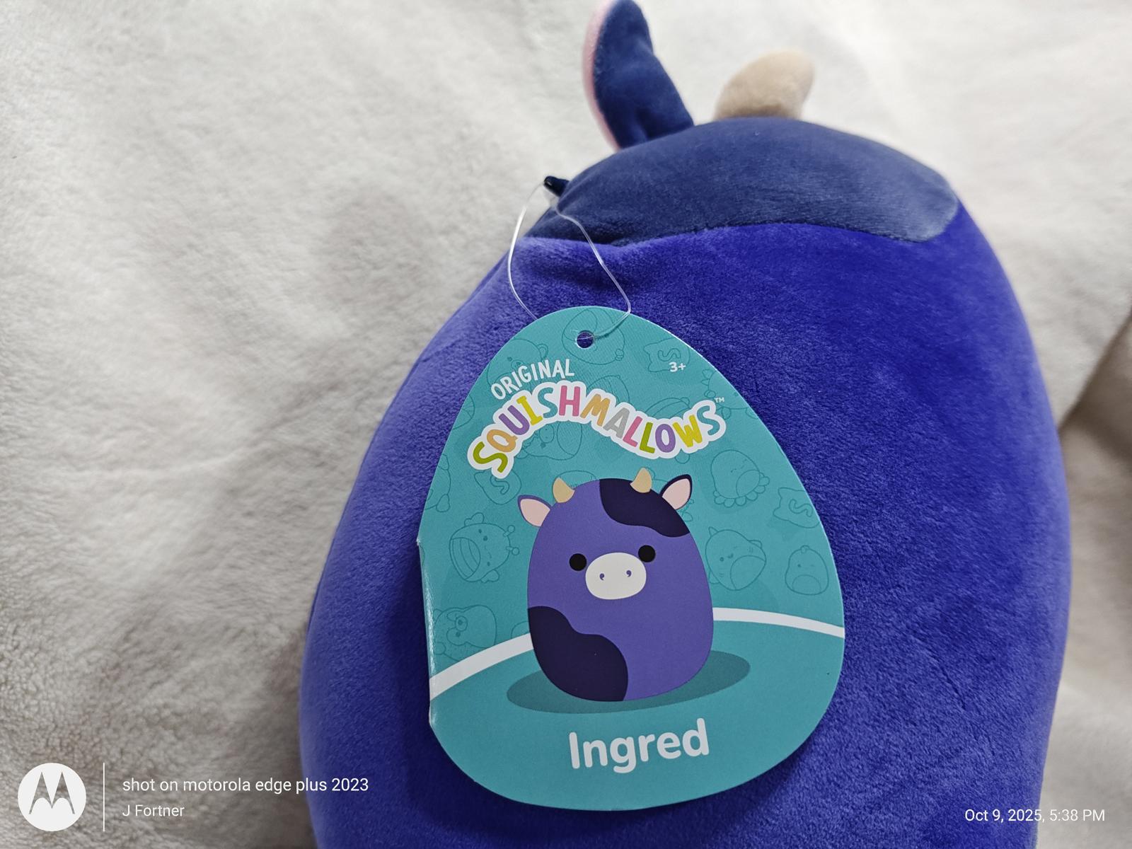 Squishmallows Ingred plush toy in purple color with a cute cow design.