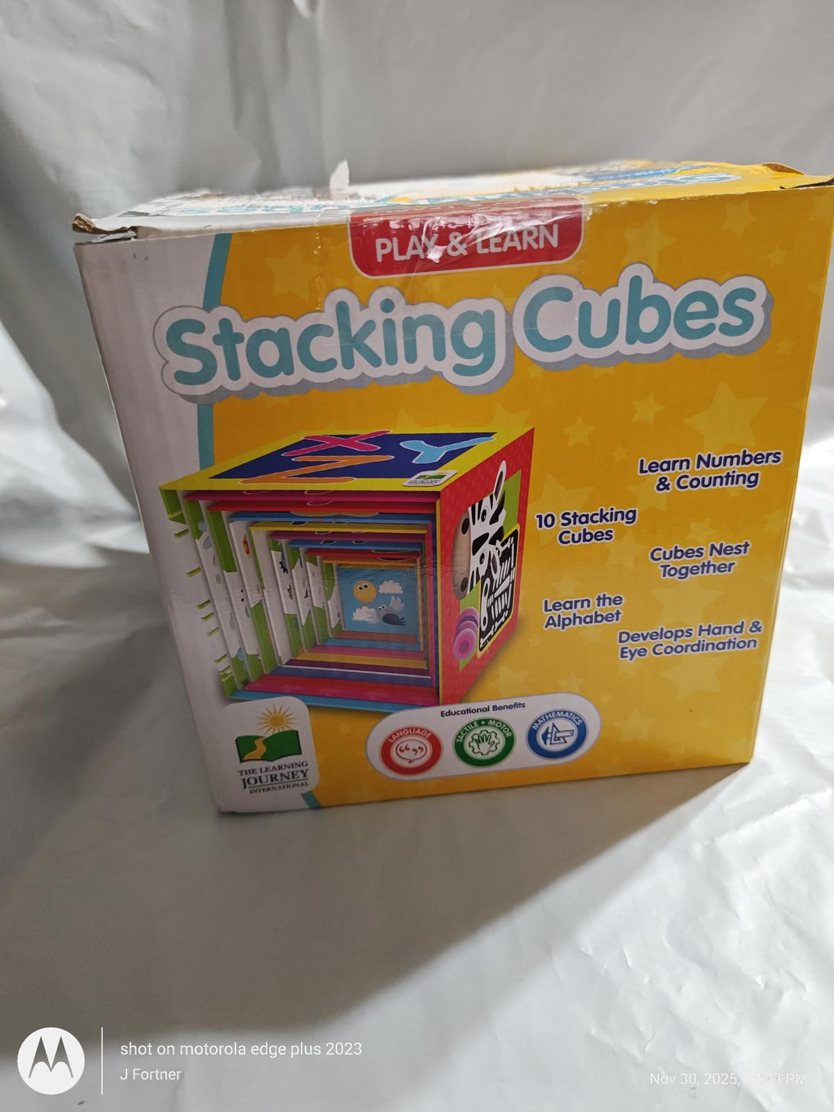 Stacking Cubes set for learning numbers and counting, featuring colorful designs and 10 cubes.