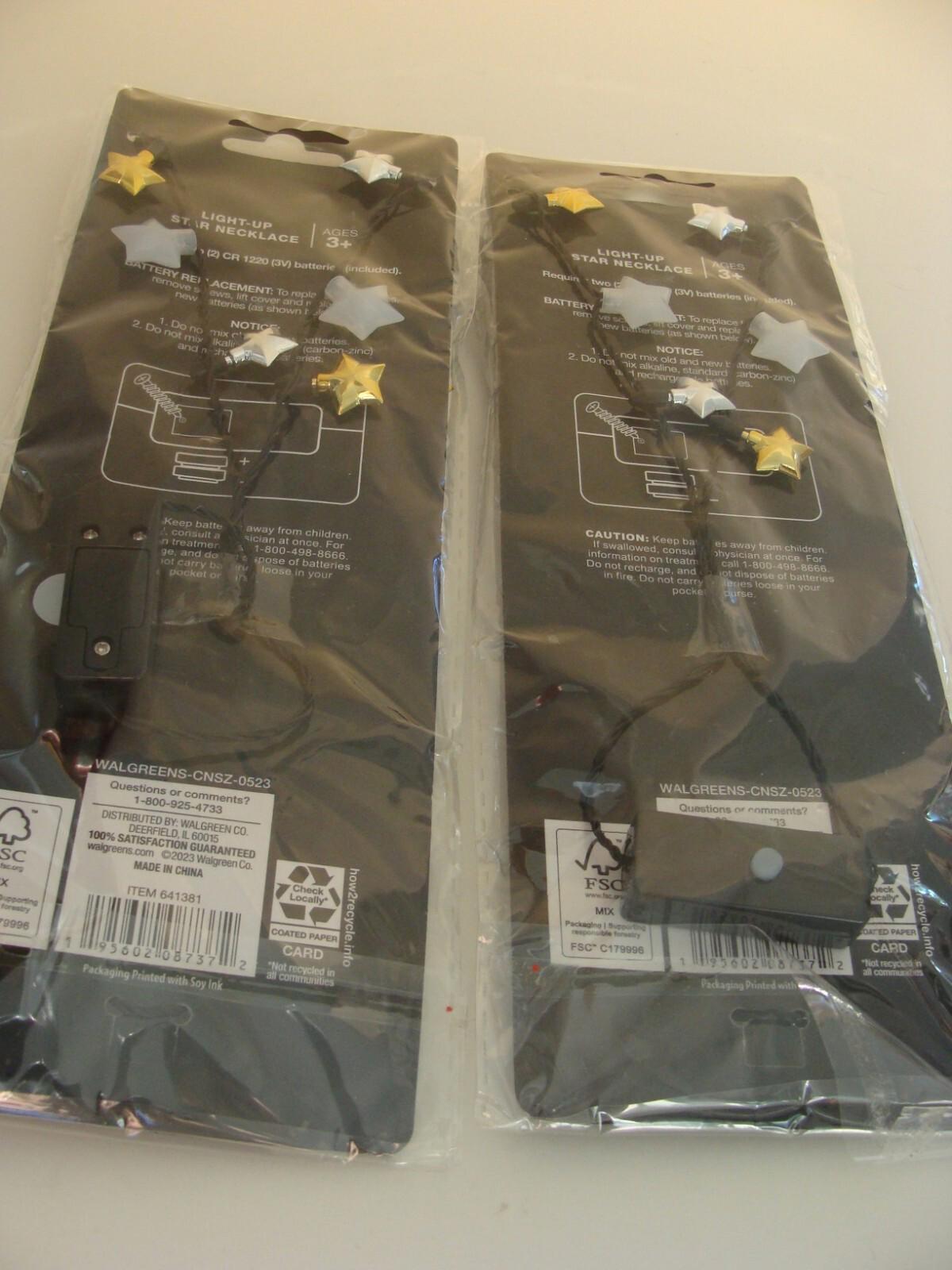 Star-themed party decorations featuring silver and gold stars on black string.