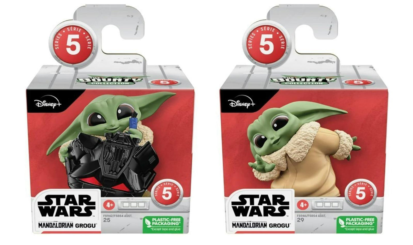 Star Wars Baby Yoda figurines in two styles, one with a blaster and the other in a cozy outfit.