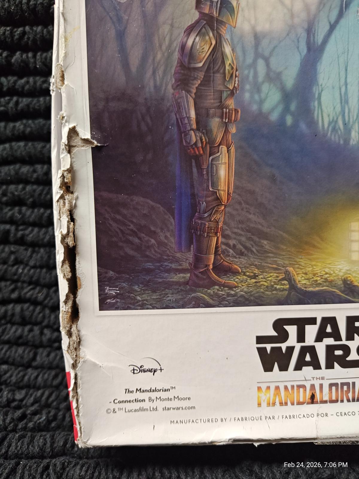 Star Wars The Mandalorian collectible box with damaged corner and artwork featuring the Mandalorian.