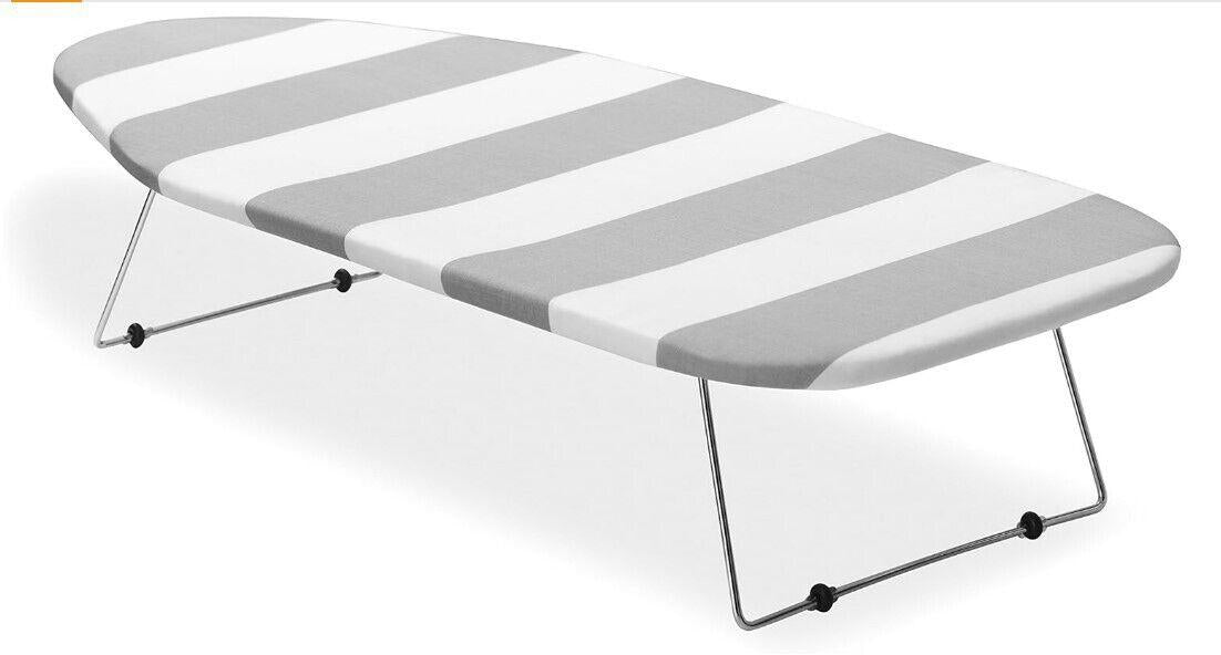 Striped Folding Beach Lounger with gray and white stripes for outdoor relaxation.