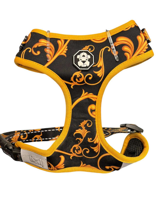 Stylish dog harness featuring a black and orange floral design with a comfortable fit.