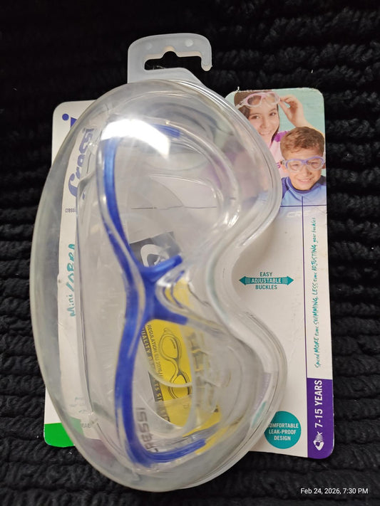 Swim Goggles with blue frame and clear lens, packaged for easy storage.