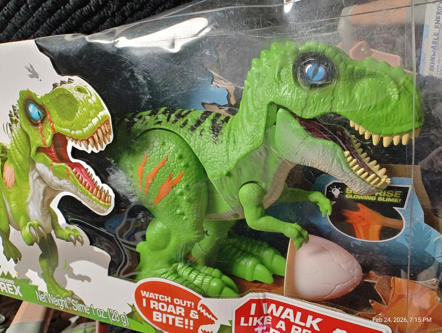 T-Rex dinosaur toy with vibrant green color, features roaring sound and interactive egg.
