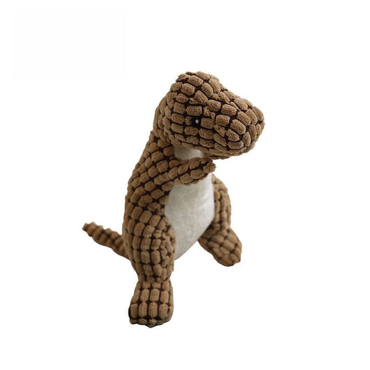 Brown dinosaur plush toy with textured fabric and a friendly expression.