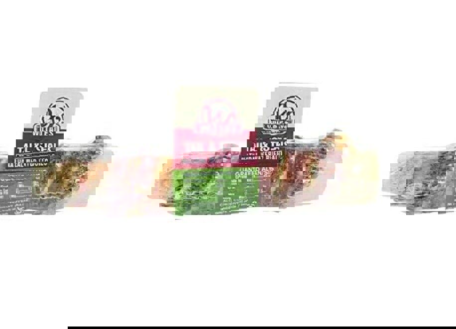 Tail & Steak natural beef rib bone for dogs, featuring a meaty texture and durable chew.