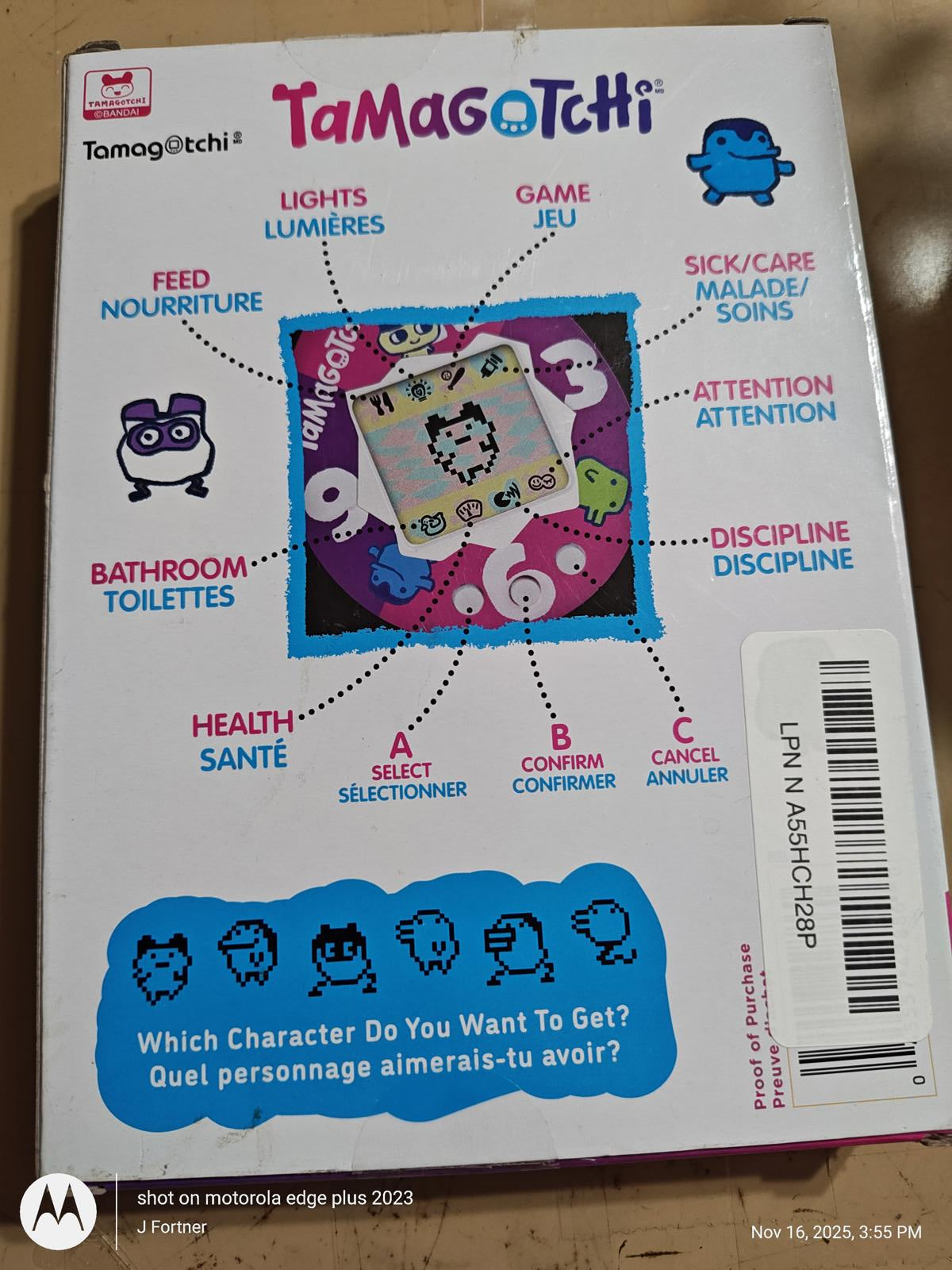 Tamagotchi game box featuring colorful characters and instructions for care and attention.