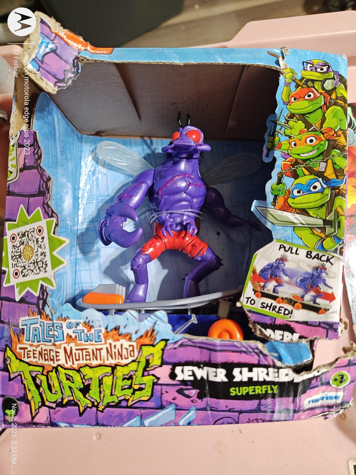 Teenage Mutant Ninja Turtles Sewer Shred action figure in purple with red shorts.