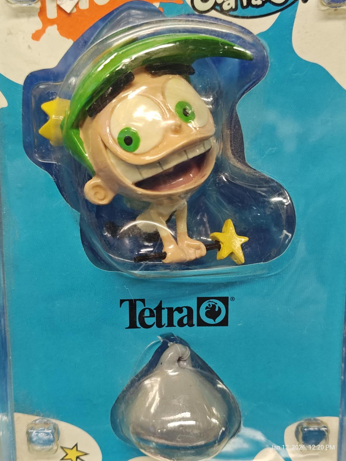 Tetra action figure featuring a smiling character with green cap and star.