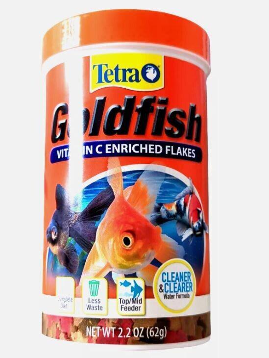 Tetra Goldfish vitamin C enriched flakes in a vibrant orange container with fish images.