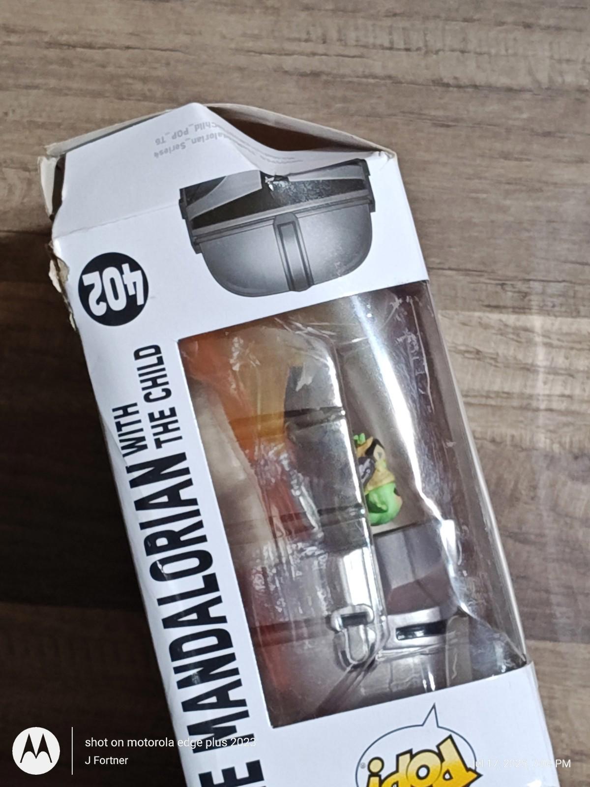 The Mandalorian with The Child action figure in packaging, showcasing detailed design.