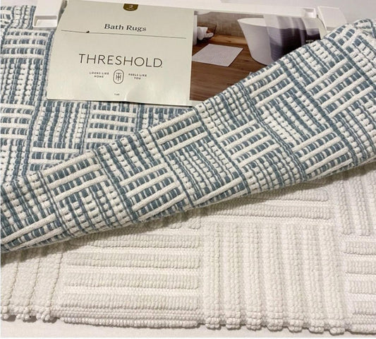 Threshold bath rug featuring a textured design in blue and white colors.