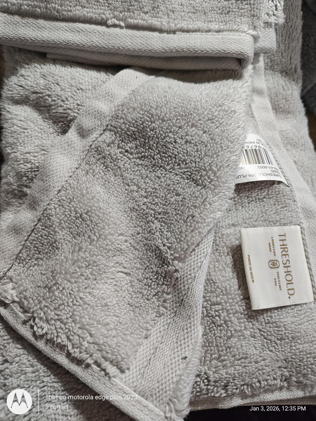 Threshold gray bath towel featuring soft texture and tag detail.