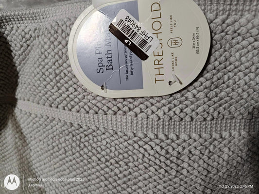 Threshold spa bath mat in soft gray color with textured surface.